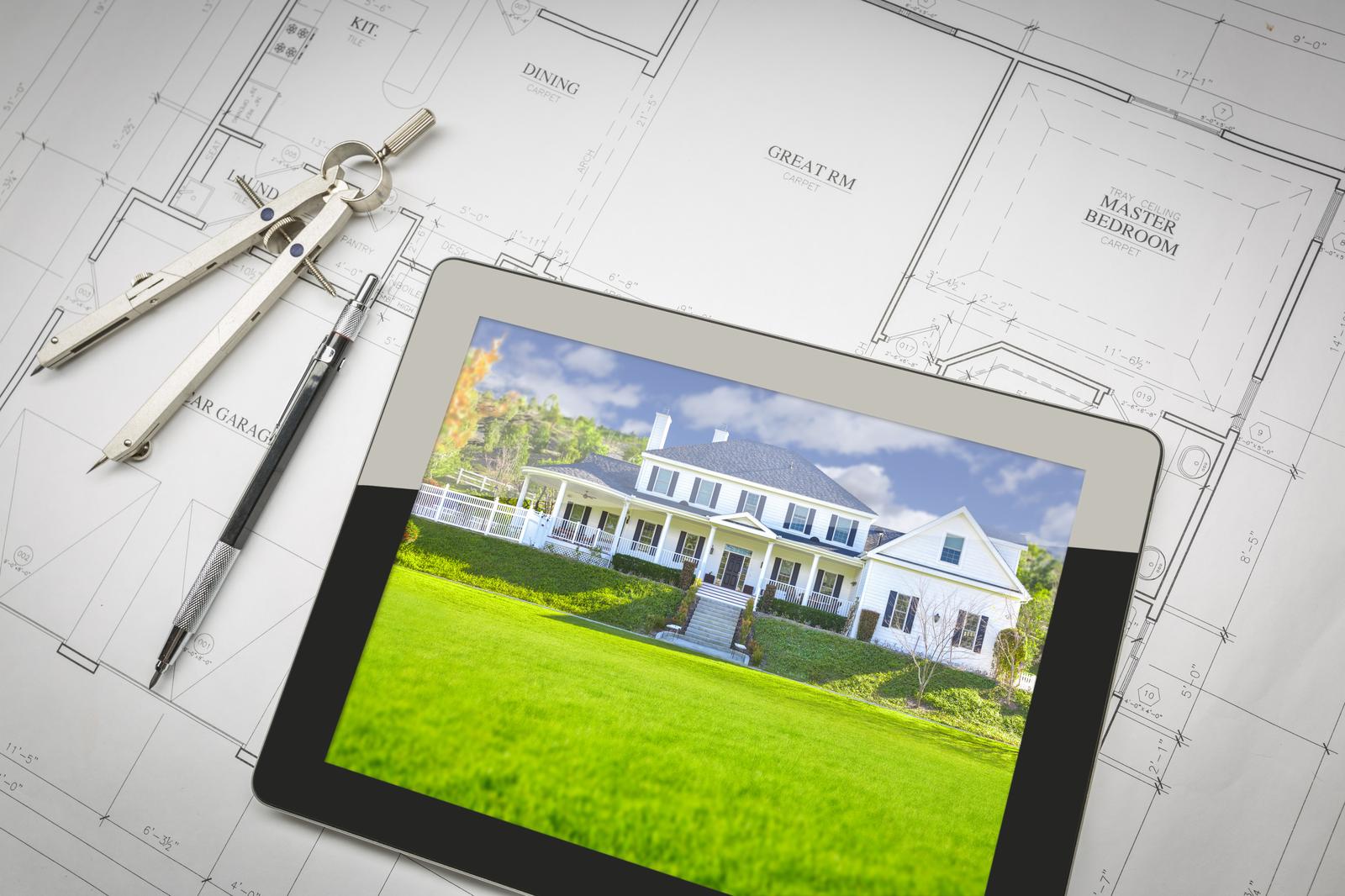 Tablet displaying a rendered landscape design over printed site plans