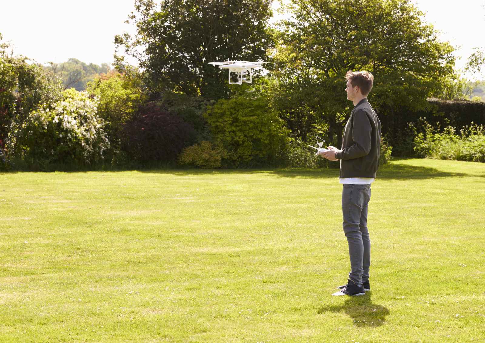 Drone hovering above a landscaped garden during an inspection flight