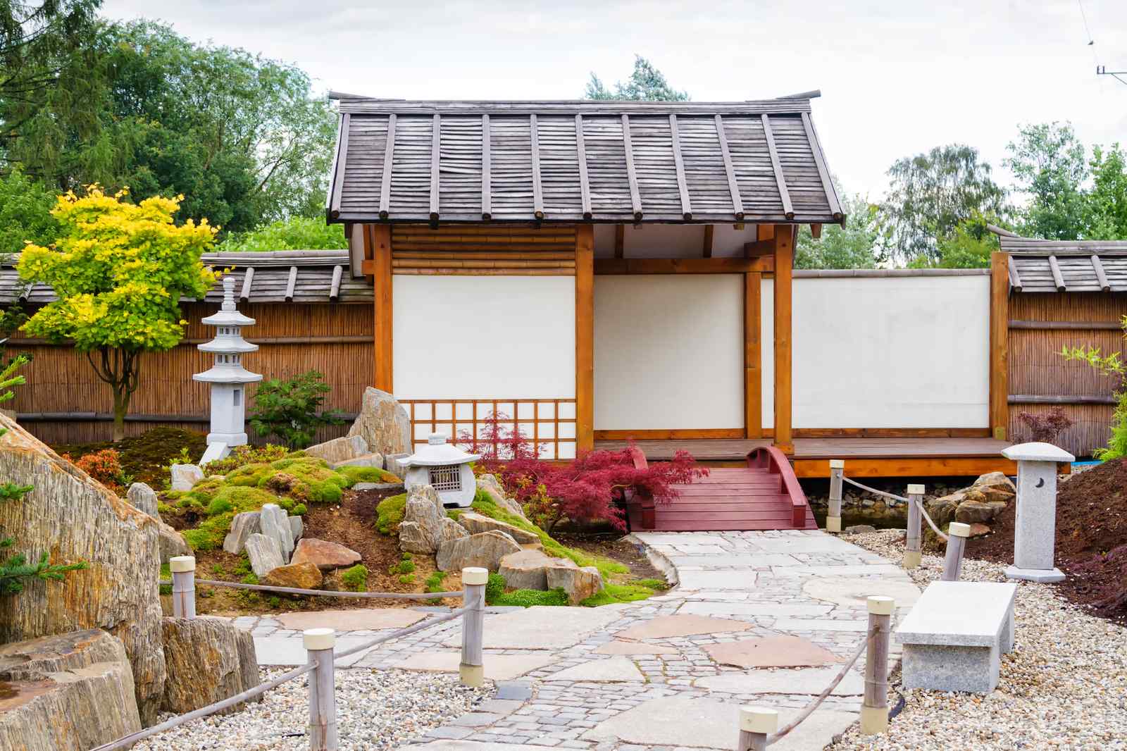 Japanese-style garden with a wooden pavilion and stone path