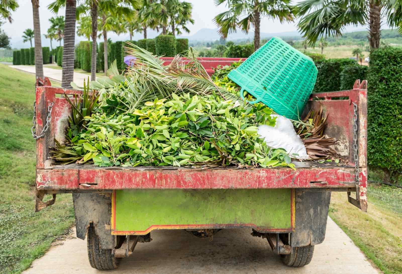 Truck loaded with collected green waste from a large landscaped estate