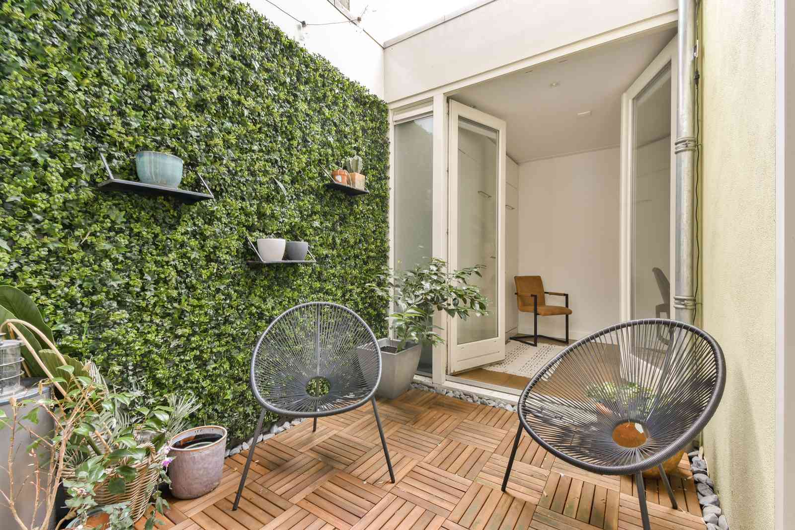Vertical garden wall optimizing planting space on a small balcony
